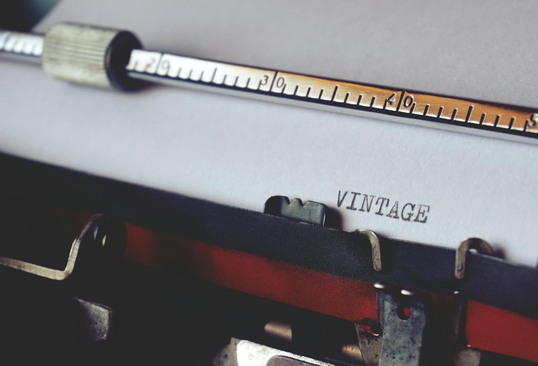 Close-up shot of a vintage typewriter typing the word 'VINTAGE'. Perfect for retro and writing themes.